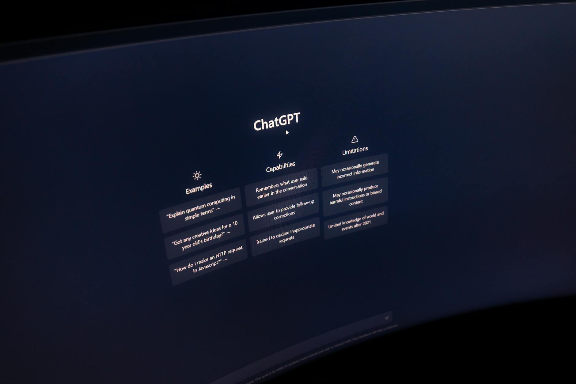 Close-up of a computer screen displaying ChatGPT interface in a dark setting. — pijushsaha.com