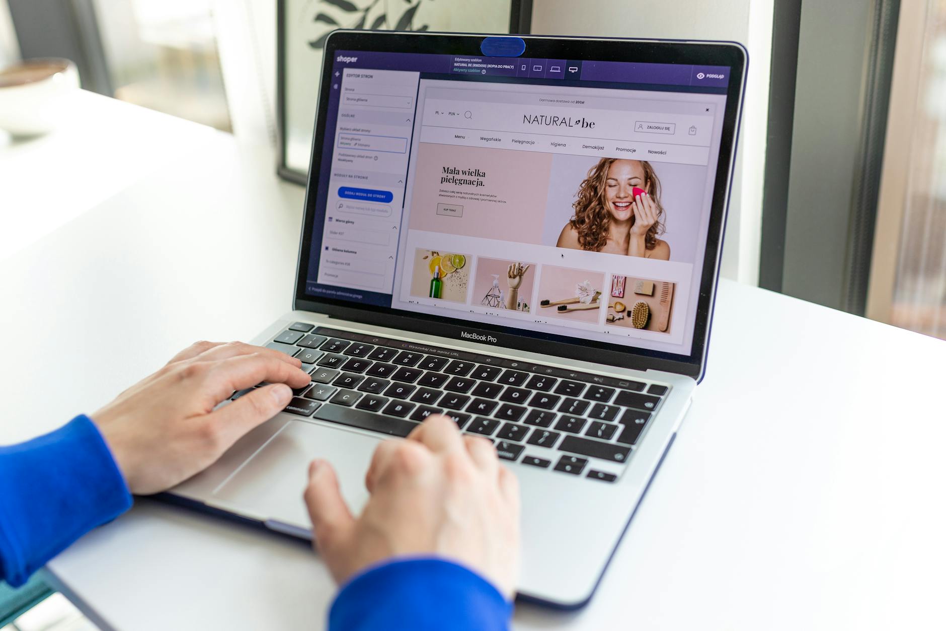 Hands typing on a laptop with an e-commerce website open, showcasing online shopping. — pijushsaha.com