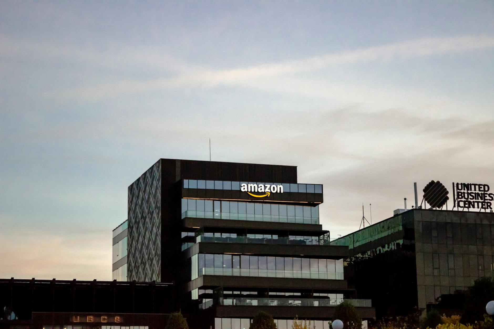 Contemporary architecture showcasing Amazon office at dusk in Iași, Romania. — pijushsaha.com