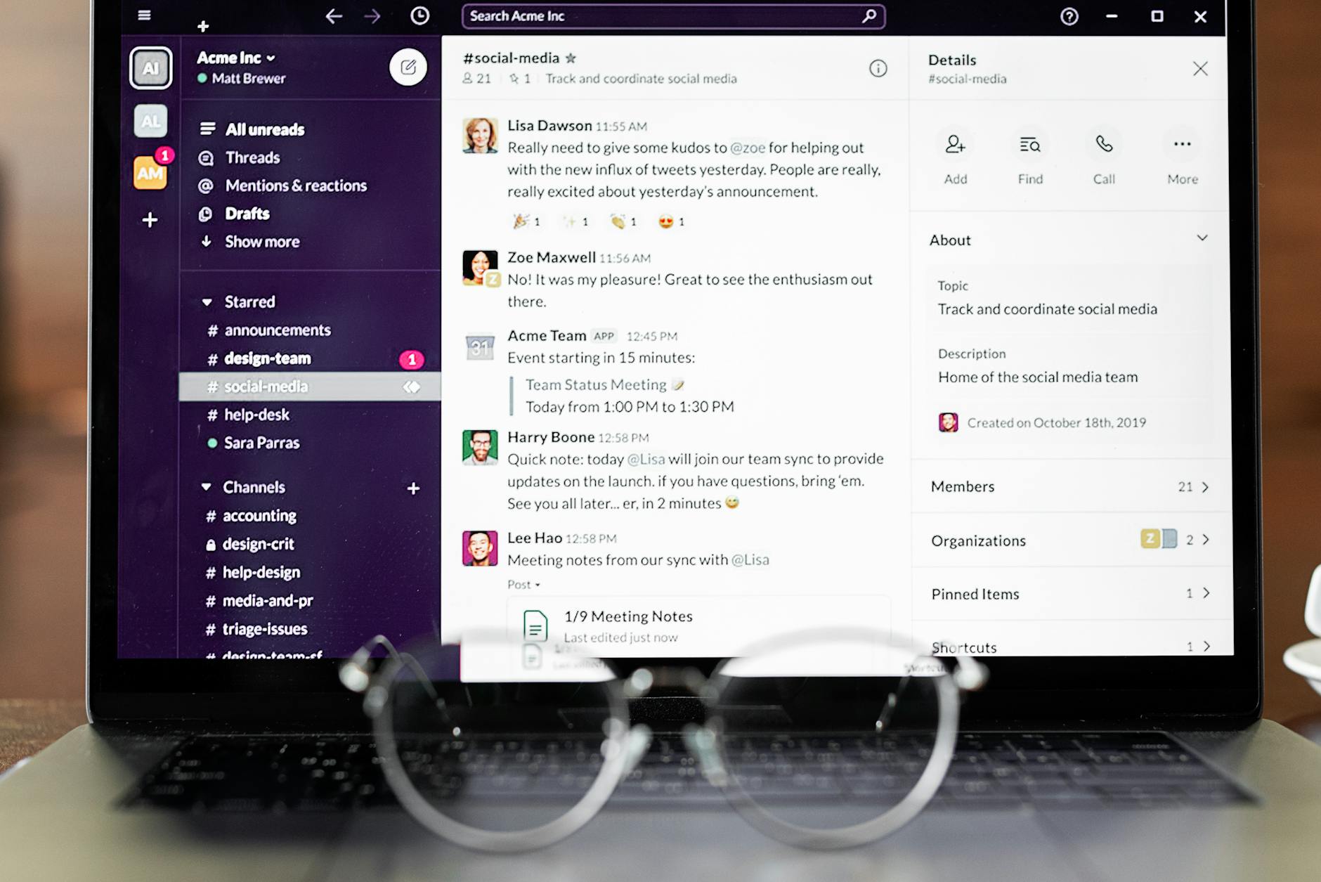 Close-up of a laptop showing a messaging app interface with eyeglasses in the foreground. — pijushsaha.com
