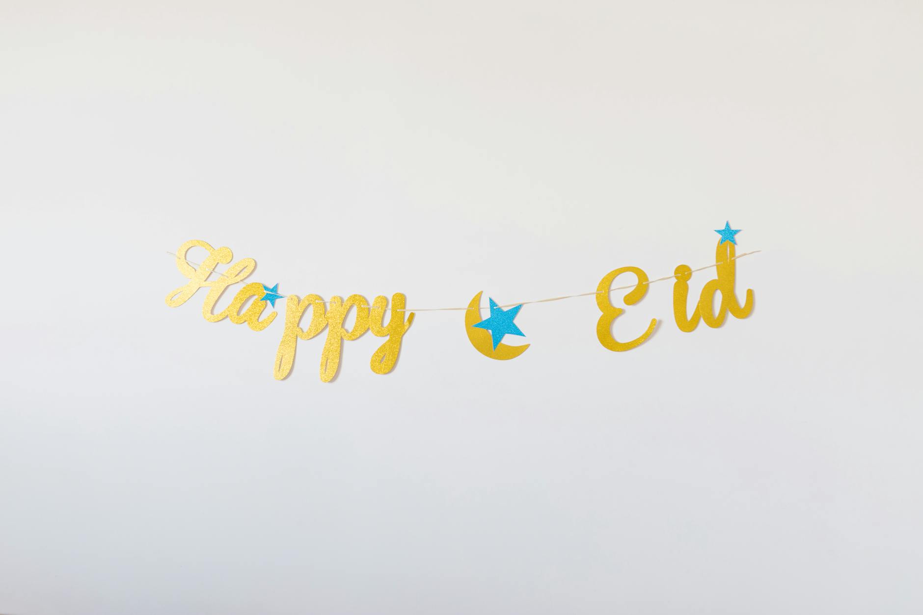 A decorative Eid Mubarak banner with stars, perfect for celebrating the Eid festival. -- pijushsaha.com