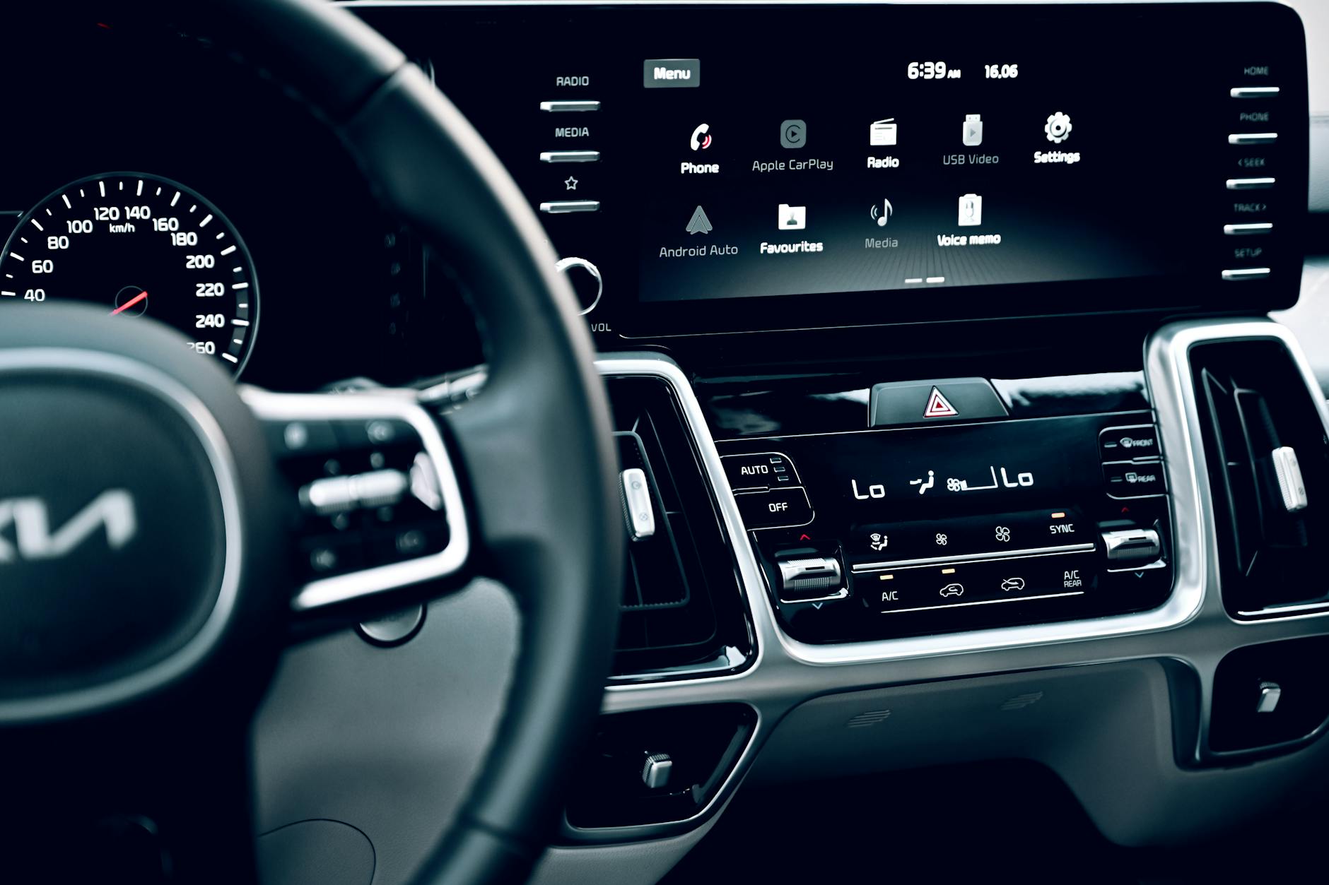 Close-up view of a luxury car's dashboard featuring a modern touchscreen display and advanced features. — pijushsaha.com