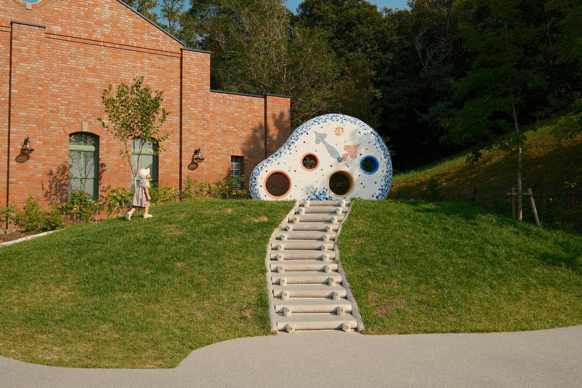 Charming whimsical structure in Ghibli Park, reflecting artistic architecture amidst lush greenery. -- pijushsaha.com