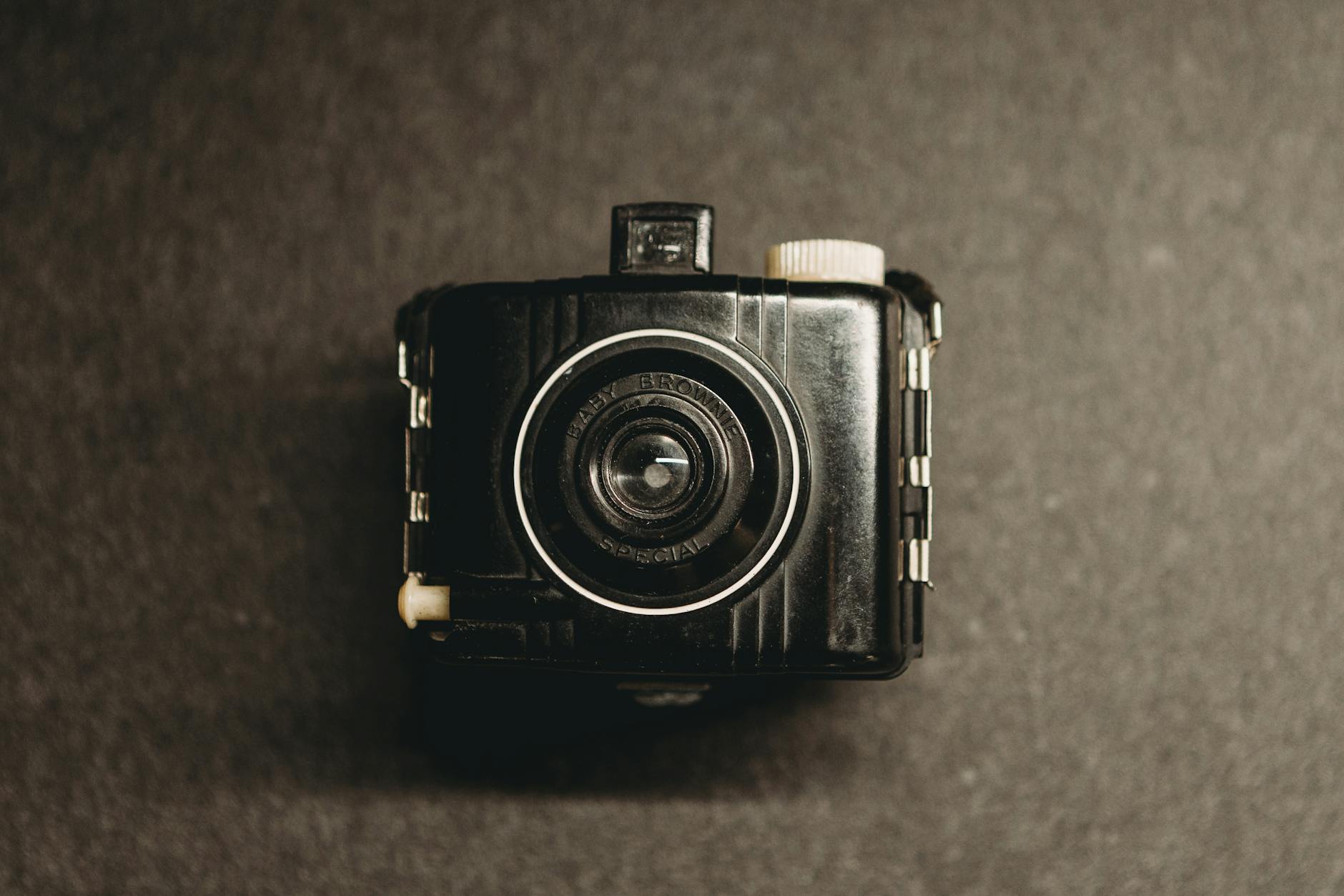 Close-up of a vintage box camera with a textured gray background in Indianapolis. -- pijushsaha.com