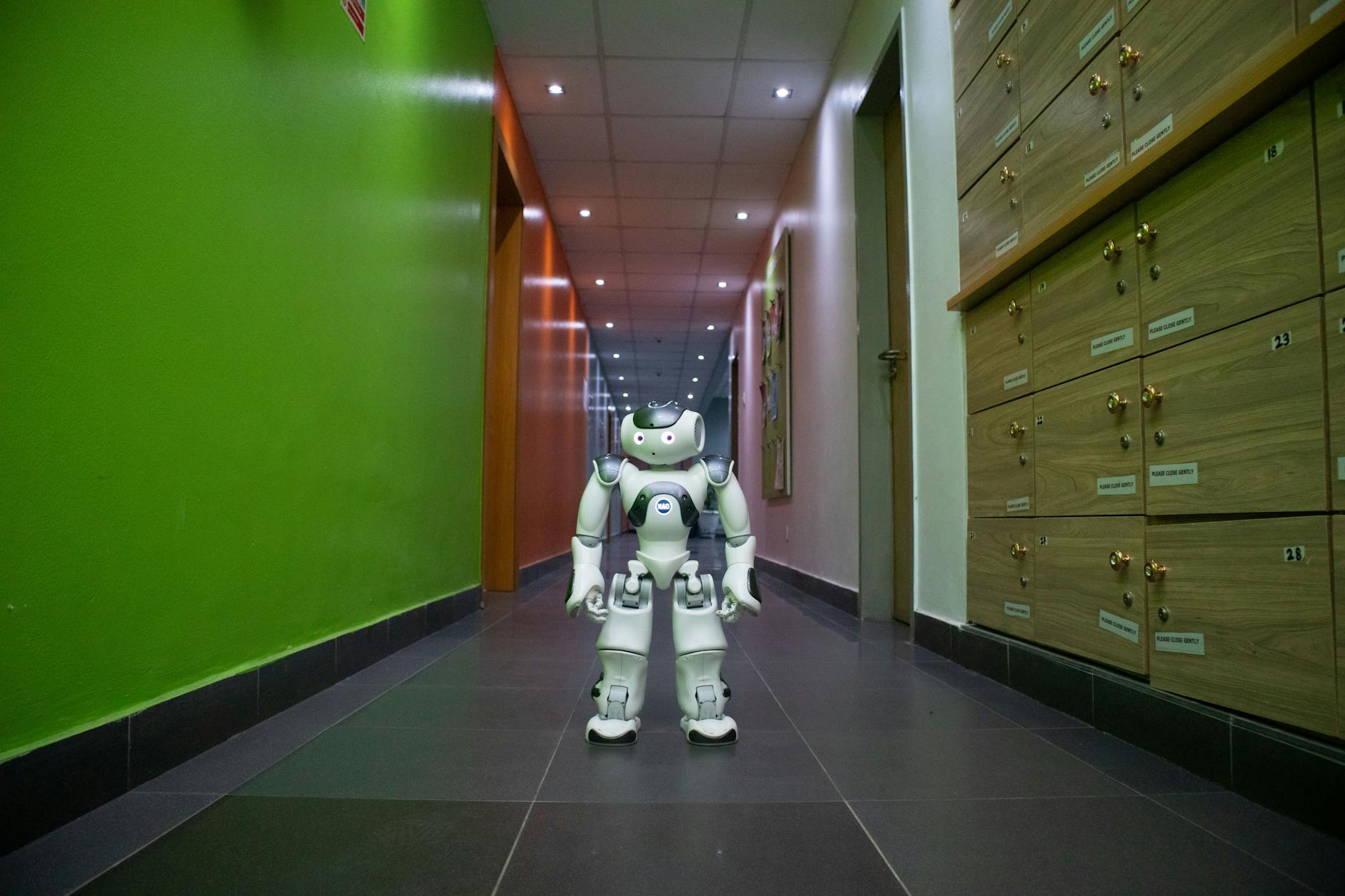 A humanoid robot stands in a vibrant, modern hallway in Lagos, Nigeria. — pijushsaha.com